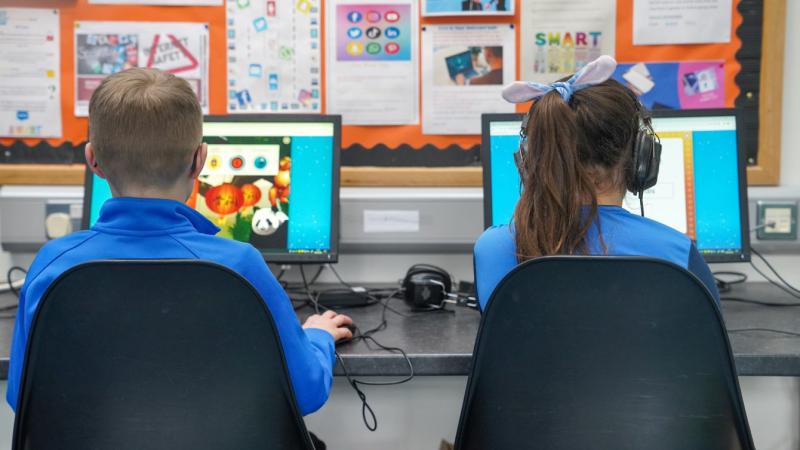 Children learning on computers