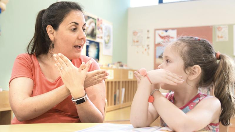 Teacher with pupil